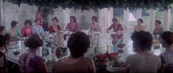 Movie still from “Zardoz” (1974), directed by John Boorman – A group of women sitting around a table; Wide shot, High angle