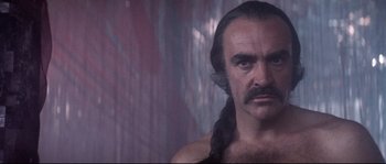 Movie still from “Zardoz” (1974), directed by John Boorman – A person with long hair; Close Up shot, Low angle