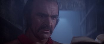 Movie still from “Zardoz” (1974), directed by John Boorman – A person with a beard; Close Up shot, Over the shoulder angle