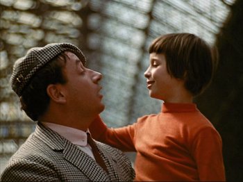 Movie still from “Zazie dans le Métro” (1960), directed by Louis Malle – A man and a boy are looking at each other; Close Up shot, High angle