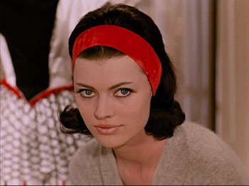 Movie still from “Zazie dans le Métro” (1960), directed by Louis Malle – A person wearing a headband; Close Up shot, Low angle