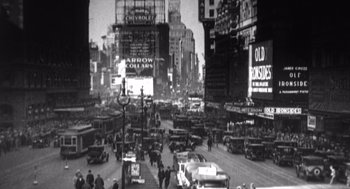 Movie still from “Zelig” (1983), directed by Woody Allen – A black and white photo of a busy city street; Extreme Wide shot, High angle