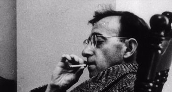 Movie still from “Zelig” (1983), directed by Woody Allen – A black and white photo of a man brushing his teeth; Close Up shot, Low angle