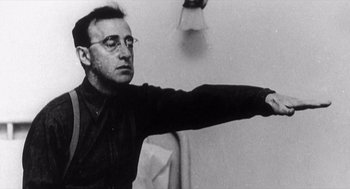 Movie still from “Zelig” (1983), directed by Woody Allen – A black and white photo of a man pointing; Close Up shot, Low angle