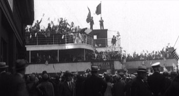 Movie still from “Zelig” (1983), directed by Woody Allen – A crowd of people standing on top of a boat; Extreme Wide shot, Low angle