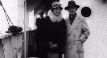 Movie still from “Zelig” (1983), directed by Woody Allen – An old photo of a man and a woman; Medium shot, Low angle