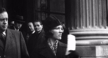 Movie still from “Zelig” (1983), directed by Woody Allen – An old black and white photo of a woman; Medium shot, Low angle