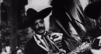 Movie still from “Zelig” (1983), directed by Woody Allen – An old photo of a man wearing a sombrero; Close Up shot, Low angle