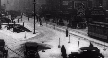 Movie still from “Zelig” (1983), directed by Woody Allen – A black and white photo of a city street; Extreme Wide shot, High angle