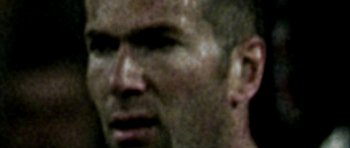 Movie still from “Zidane: A 21st Century Portrait” (2006), directed by Philippe Parreno – A blurry picture of a man's face and ear; Extreme Close Up shot, High angle