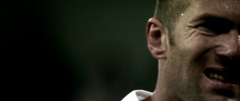 Movie still from “Zidane: A 21st Century Portrait” (2006), directed by Philippe Parreno – A man's ear and ear tag; Extreme Close Up shot, Low angle