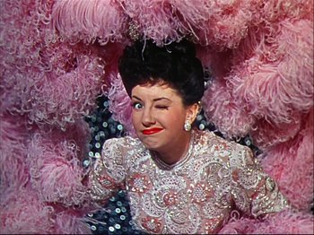 Movie still from “Ziegfeld Follies” (1945), directed by Roy Del Ruth – A person wearing a dress; Medium shot, Low angle