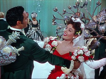 Movie still from “Ziegfeld Follies” (1945), directed by Roy Del Ruth – A man and a woman dancing in front of a crowd; Medium shot, Over the shoulder angle