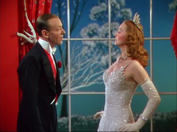 Movie still from “Ziegfeld Follies” (1945), directed by Roy Del Ruth – A man and a woman dressed in formal wear; Medium shot, Low angle