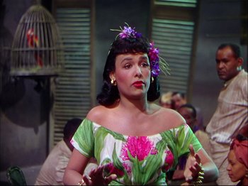 Movie still from “Ziegfeld Follies” (1945), directed by Roy Del Ruth – A woman with a flower in her hair; Medium shot, Low angle