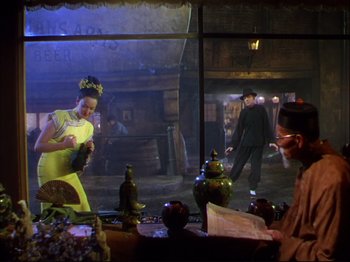 Movie still from “Ziegfeld Follies” (1945), directed by Roy Del Ruth – A man and a woman are standing in front of a window; Wide shot, Over the shoulder angle