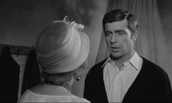 Movie still from “Zorba the Greek” (1964), directed by Michael Cacoyannis – An older man and a younger woman in a room; Close Up shot, Over the shoulder angle