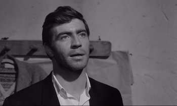 Movie still from “Zorba the Greek” (1964), directed by Michael Cacoyannis – Black and white photograph of a man looking up; Close Up shot, Low angle