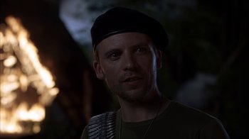 Movie still from “eXistenZ” (1999), directed by David Cronenberg – A person wearing a hat; Close Up shot, Over the shoulder angle