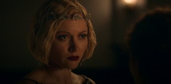 Movie still from “Archive 81” (2022), created by Rebecca Sonnenshine – A person wearing a crown; Close Up shot, Over the shoulder angle