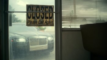 Movie still from “Army of the Dead” (2021), directed by Zack Snyder – A closed sign hanging in front of a window; Medium shot, Low angle