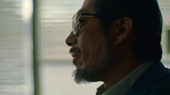 Movie still from “Army of the Dead” (2021), directed by Zack Snyder – A person with a beard wearing glasses; Extreme Close Up shot, Low angle