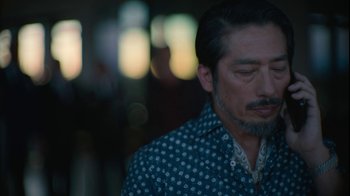 Movie still from “Army of the Dead” (2021), directed by Zack Snyder – A person wearing a shirt; Close Up shot, Low angle