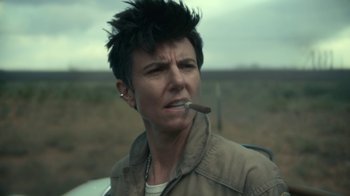 Movie still from “Army of the Dead” (2021), directed by Zack Snyder – A person with a cigarette in his mouth; Close Up shot, Over the shoulder angle