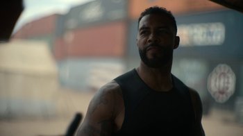 Movie still from “Army of the Dead” (2021), directed by Zack Snyder – A person with a tattoo on his arm; Close Up shot, Low angle