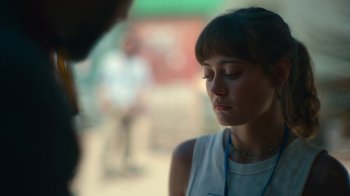 Movie still from “Army of the Dead” (2021), directed by Zack Snyder – A young woman is looking down at her face; Close Up shot, Over the shoulder angle