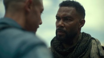 Movie still from “Army of the Dead” (2021), directed by Zack Snyder – Two men are facing each other in a room; Close Up shot, Over the shoulder angle