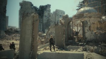 Movie still from “Army of the Dead” (2021), directed by Zack Snyder – A person standing in a destroyed city; Extreme Wide shot, Low angle