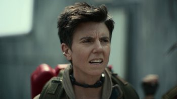 Movie still from “Army of the Dead” (2021), directed by Zack Snyder – A person wearing a jacket; Close Up shot, Over the shoulder angle