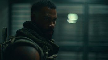 Movie still from “Army of the Dead” (2021), directed by Zack Snyder – A person with a beard; Close Up shot, Over the shoulder angle