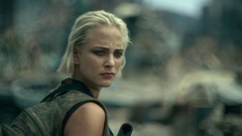 Movie still from “Army of the Dead” (2021), directed by Zack Snyder – A person holding a gun; Close Up shot, Over the shoulder angle