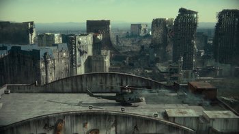 Movie still from “Army of the Dead” (2021), directed by Zack Snyder – A helicopter is flying over a city with buildings in the background; Extreme Wide shot, High angle