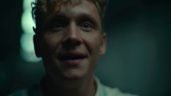 Movie still from “Army of the Dead” (2021), directed by Zack Snyder – A man's face in a dark room; Close Up shot, Low angle