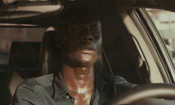 Movie still from “Atlantics” (2019), directed by Mati Diop – Close Up shot, High angle