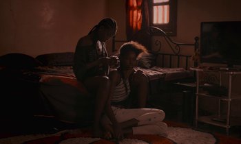 Movie still from “Atlantics” (2019), directed by Mati Diop – Medium shot, Over the shoulder angle