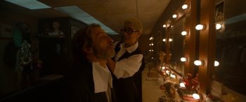 Movie still from “Bardo: False Chronicle of a Handful of Truths” (2022), directed by Alejandro G. Iñárritu – A man and a woman are getting their hair cut; Medium shot, Over the shoulder angle