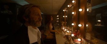 Movie still from “Bardo: False Chronicle of a Handful of Truths” (2022), directed by Alejandro G. Iñárritu – A man and a woman in front of a vanity mirror; Medium shot, Over the shoulder angle