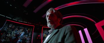 Movie still from “Bardo: False Chronicle of a Handful of Truths” (2022), directed by Alejandro G. Iñárritu – A person wearing a suit and tie; Close Up shot, Low angle