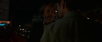 Movie still from “Bardo: False Chronicle of a Handful of Truths” (2022), directed by Alejandro G. Iñárritu – A man in a suit talking to another man in a suit; Close Up shot, Over the shoulder angle