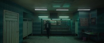 Movie still from “Bardo: False Chronicle of a Handful of Truths” (2022), directed by Alejandro G. Iñárritu – A man standing in front of an open window; Wide shot, Low angle