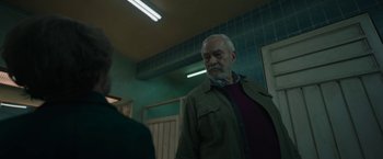 Movie still from “Bardo: False Chronicle of a Handful of Truths” (2022), directed by Alejandro G. Iñárritu – An older man standing in front of a mirror; Medium shot, Over the shoulder angle