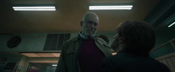 Movie still from “Bardo: False Chronicle of a Handful of Truths” (2022), directed by Alejandro G. Iñárritu – An older man is talking to a younger man; Medium shot, Low angle