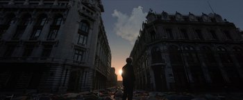 Movie still from “Bardo: False Chronicle of a Handful of Truths” (2022), directed by Alejandro G. Iñárritu – A person is standing in the middle of a street; Extreme Wide shot, Low angle