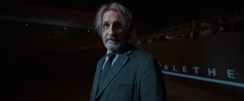 Movie still from “Bardo: False Chronicle of a Handful of Truths” (2022), directed by Alejandro G. Iñárritu – An older man in a suit and tie looking at the camera; Close Up shot, Low angle