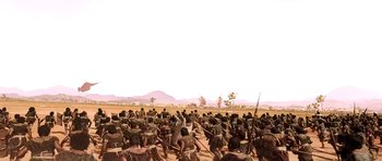 Movie still from “Baahubali: The Beginning” (2015), directed by S.S. Rajamouli – A group of people standing on top of a dirt field; Extreme Wide shot, High angle