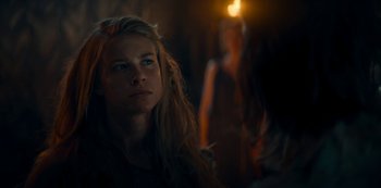 Movie still from “Barbarians” (2020), created by Arne Nolting – A woman with long blonde hair looking into the distance; Close Up shot, Over the shoulder angle